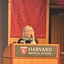 Joan Brugge giving a speed talk